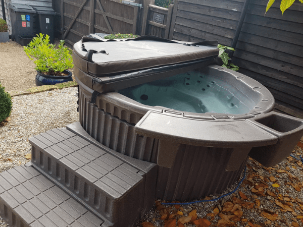 half covered hot tub by south east hot tubs